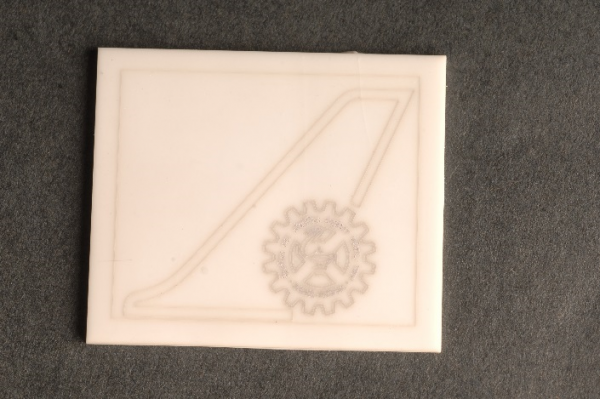 Laser engraved CSIR-NAL logo on alumina ceramic substrate