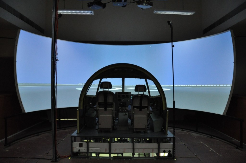 SARAS Flight Simulator Facility This facility is being used by the flight crew primarily for procedures training and by the SARAS design teams for testing of the systems like AFCS. The specifications of this flight simulator have been jointly evolved between FMCD, C-CADD and SARAS flight crew from ASTE. The simulation models of SARAS specific sub-systems are developed and integrated to the flight simulator facility. Programmable feel system for reversible primary flight control has also been integrated. The cockpit panels and displays resembling SARAS aircraft and driven by sub-system simulation models are integrated though an I/O system. Further, SARAS AFCS has also been integrated for autopilot testing. The visual database has been developed using open source tools and corresponds HAL Bangalore International Airport and the surrounding terrain.1
